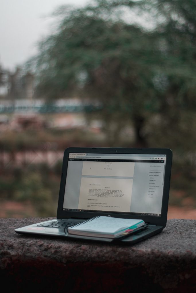 Image dedicated to Opened book placed on the table with notebook Post.