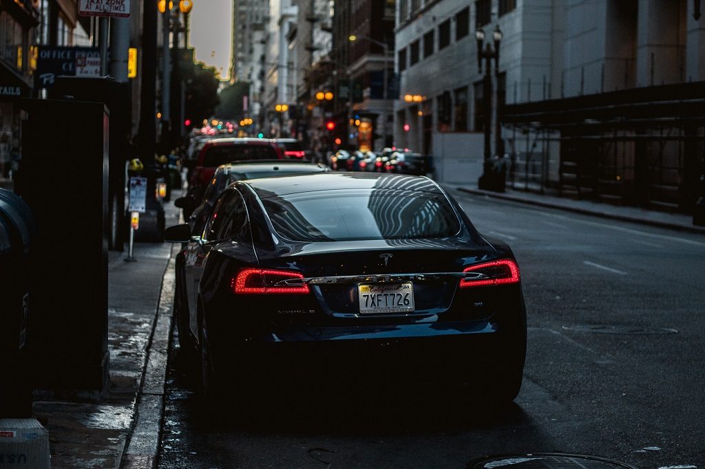 Parked car in the town on the evening street