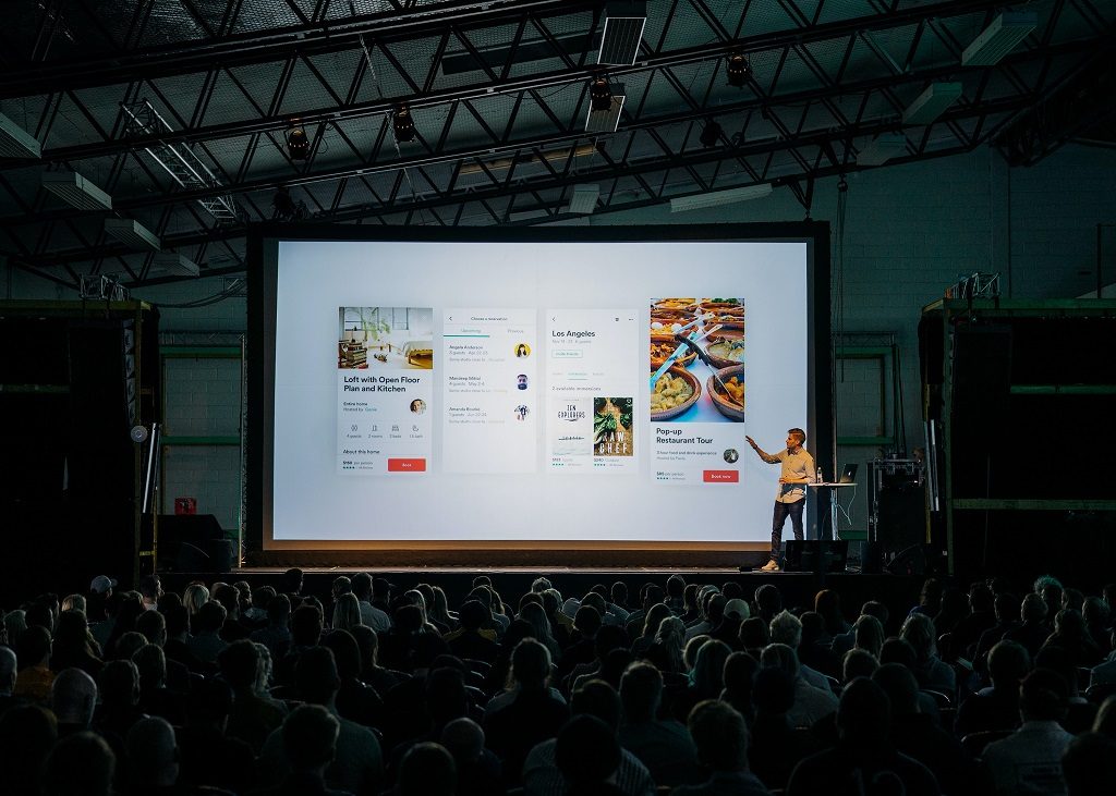 Man showing his presentation on a pulic meeting